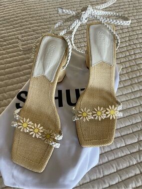SCHUTZ White Braided Strap Sandals with Daisy detail at toe.